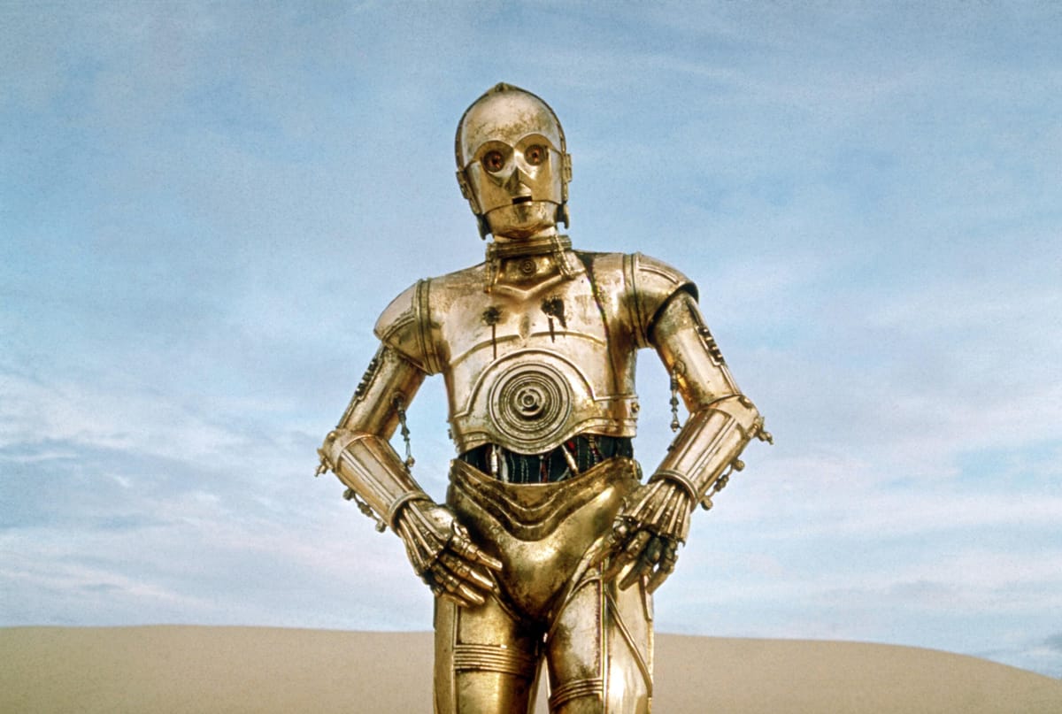 How many forms of communication is C-3PO fluent in?
