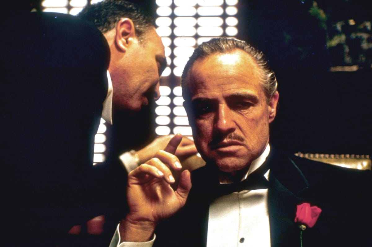 Who was offered to direct The Godfather before Francis Ford Coppola?